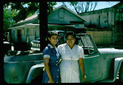 Saipan 1956, No. 0073 Two Women in Front of American Automobiles